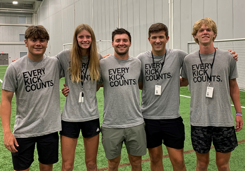 Duncan with group at facility