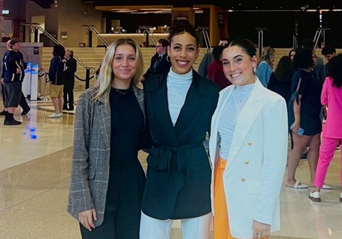 Membership recipients Olivia Gehrke (center) and Caitlin Crome (right)