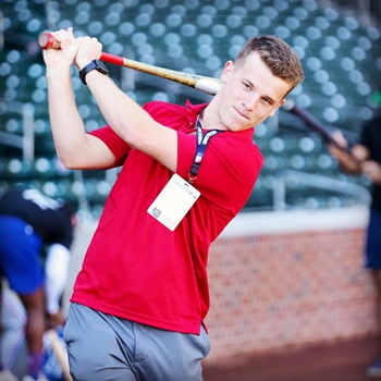 Daniel Crooks swinging a baseball batt