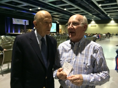 Two men at a conference