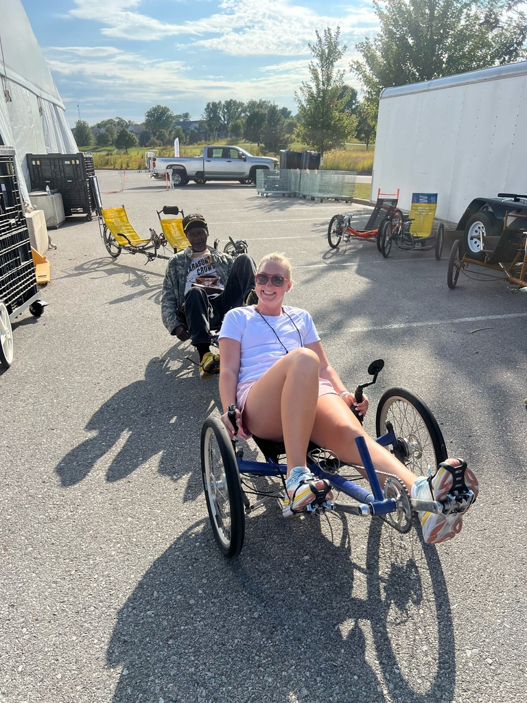 Veteran and TR student on adaptive bike 