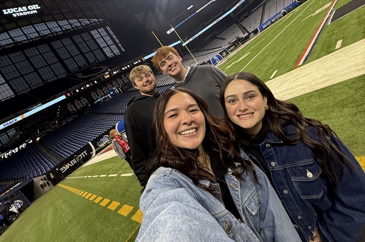 UISRM case team on Lucas Oil football field