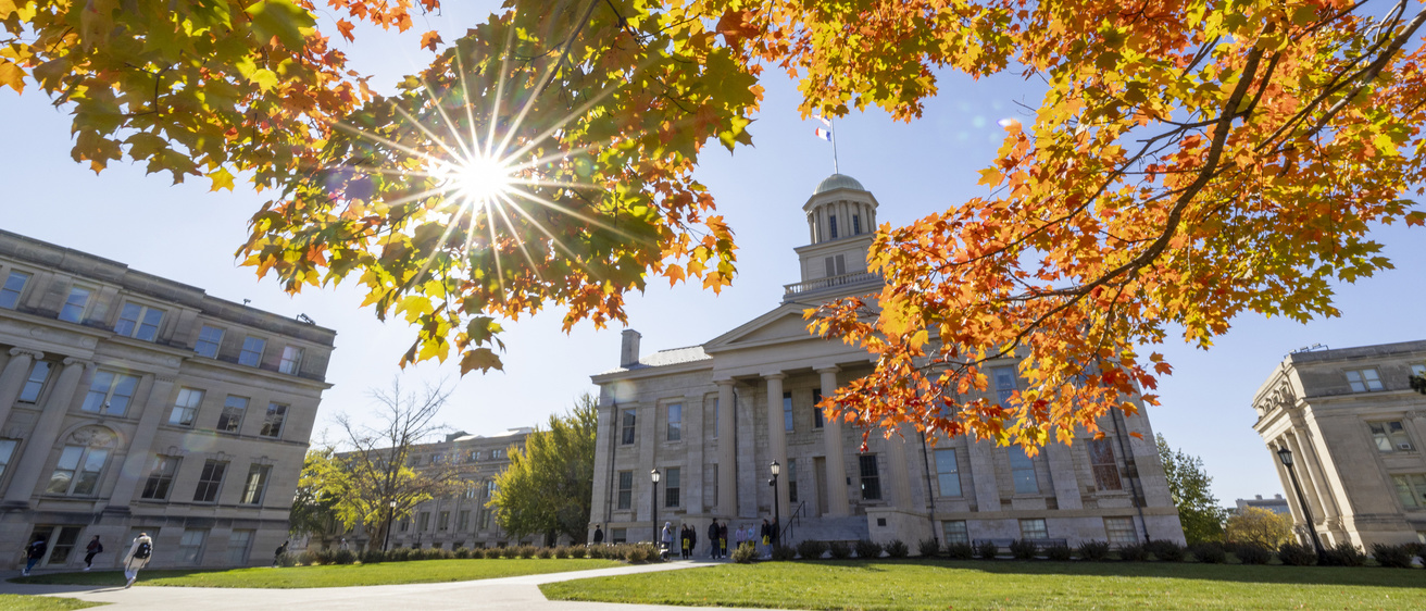 photos of Old cap witha sun bursting through the fall leaves