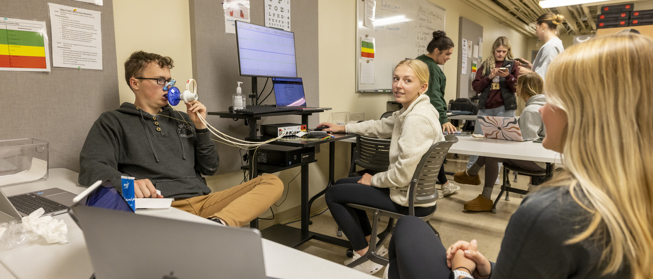 students doing a breathing test in class
