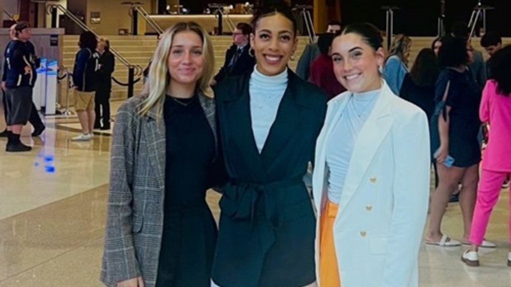 Membership recipients Olivia Gehrke (center) and Caitlin Crome (right)